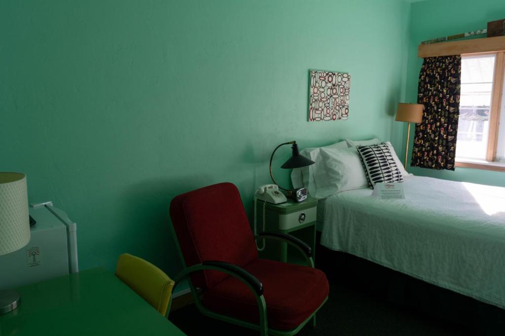 Postel nebo postele na pokoji v ubytování Holiday Music Motel
