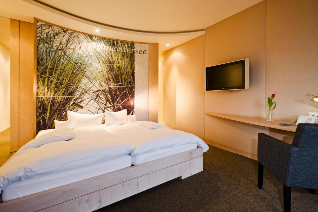 Postel nebo postele na pokoji v ubytování Hotel Kaufmann