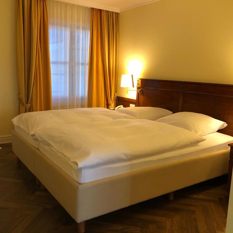 Postel nebo postele na pokoji v ubytování Hotel Scherf
