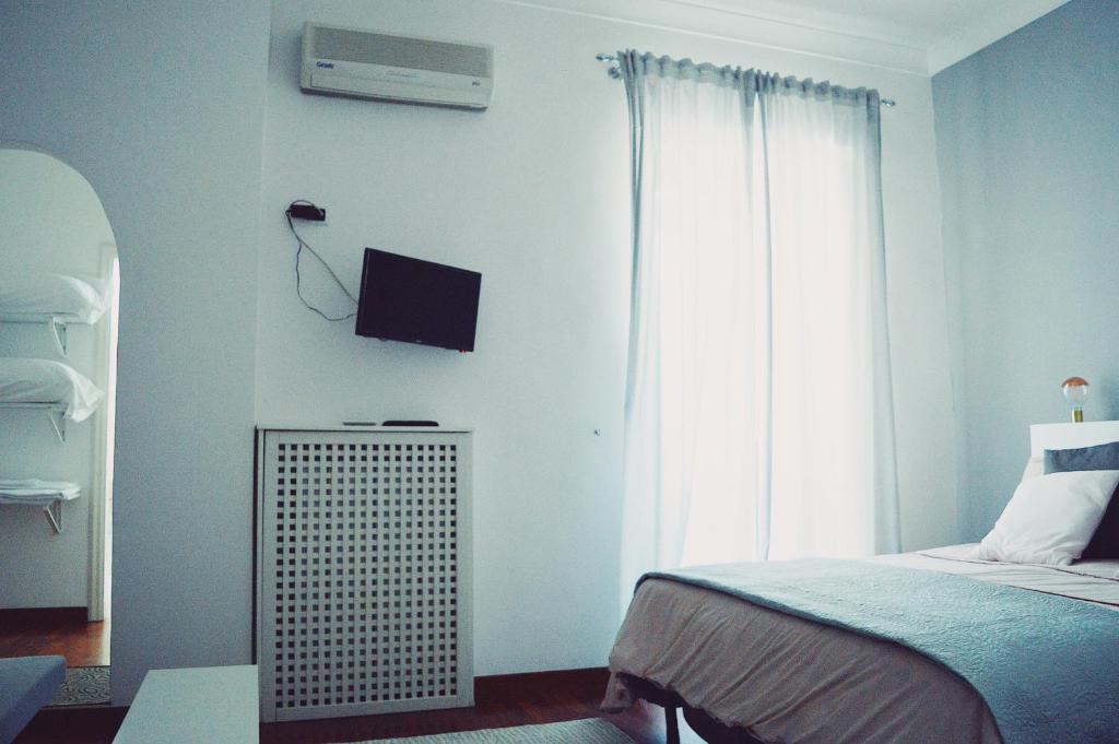 Letto o letti in una camera di Civico Vesuvio B&B