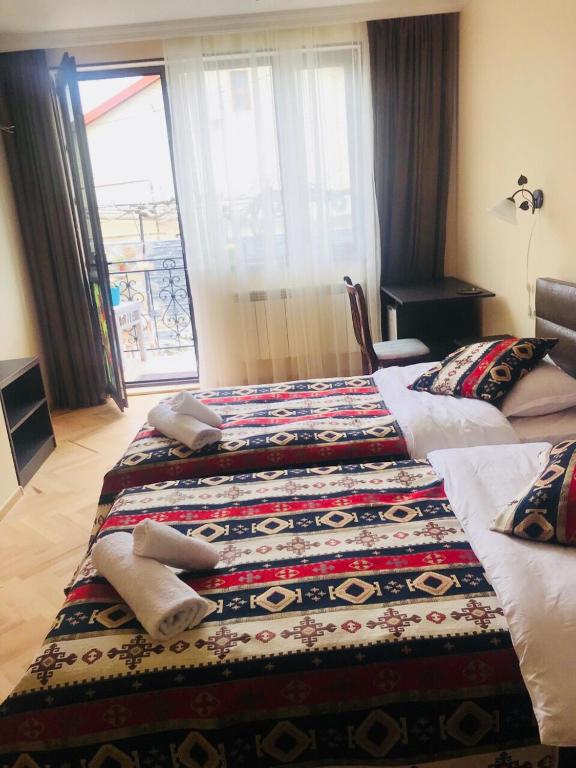 Postel nebo postele na pokoji v ubytování The oldest Tbilisi