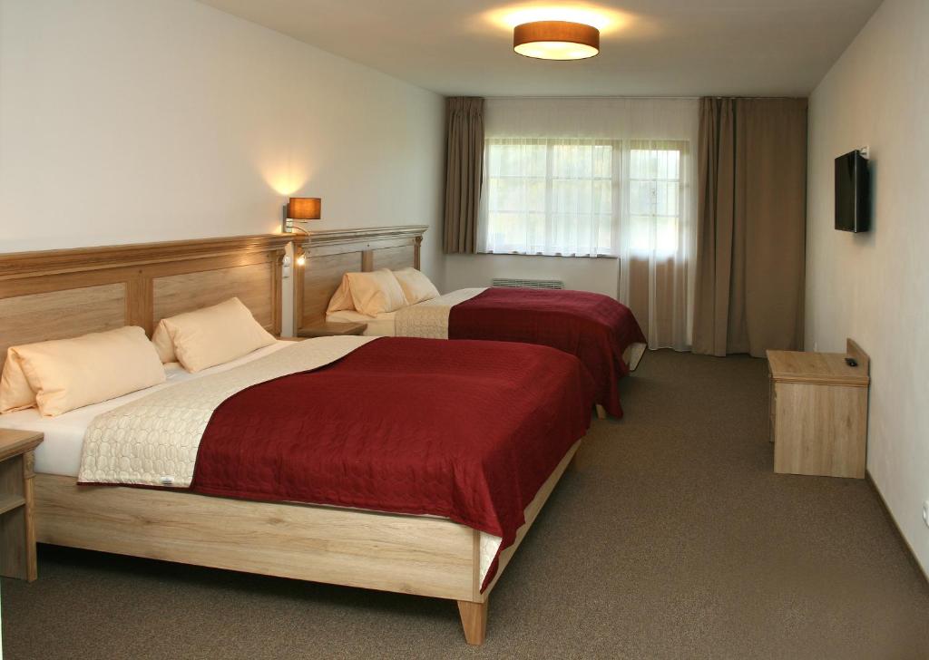 Postel nebo postele na pokoji v ubytování Hotel Resort Stein