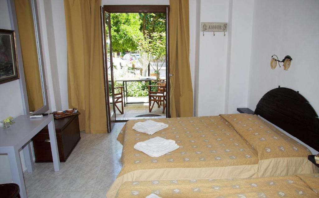 Postel nebo postele na pokoji v ubytování Mirto Apartments