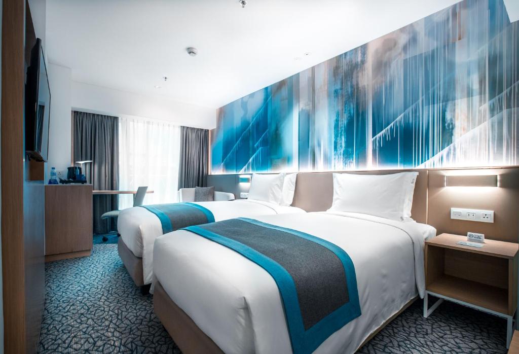 Postel nebo postele na pokoji v ubytování Holiday Inn Express Manila Newport City by IHG