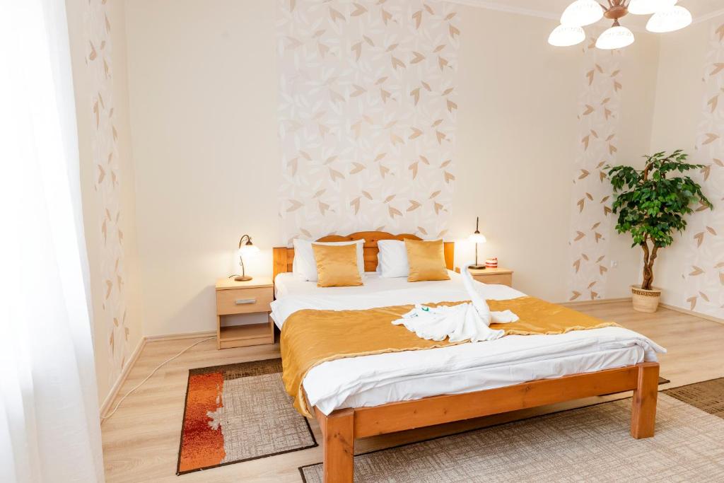 Posteľ alebo postele v izbe v ubytovaní Almafa Apartmanház