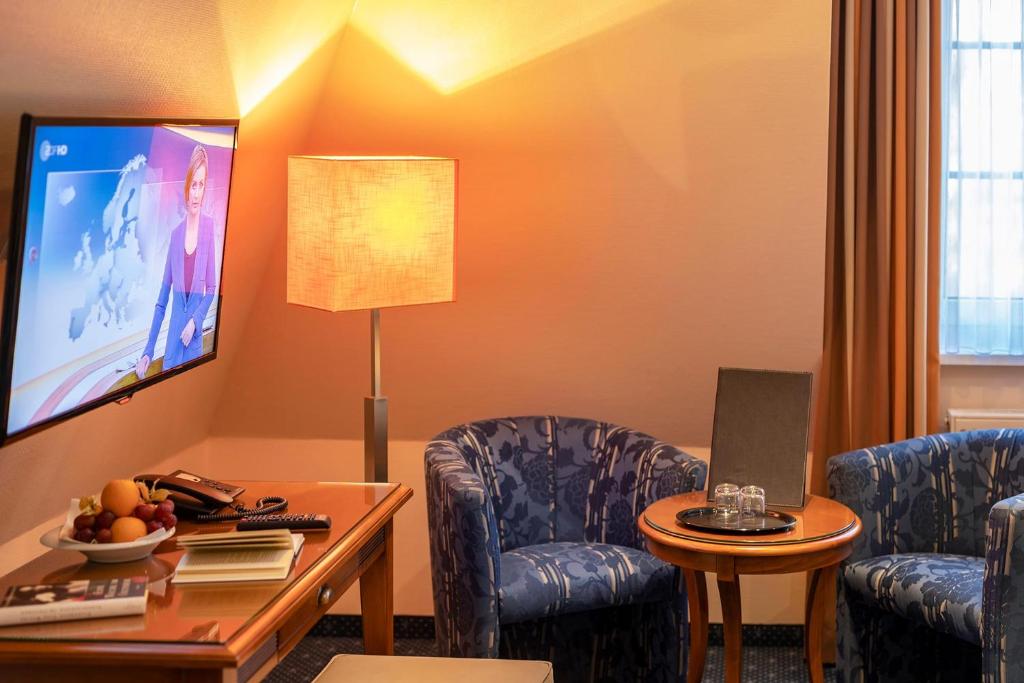 TV a/nebo společenská místnost v ubytování Dünenhotel am Meer