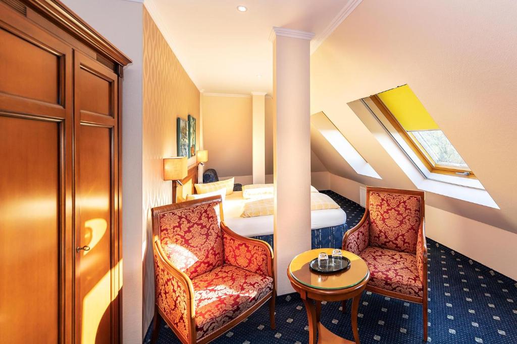 Postel nebo postele na pokoji v ubytování Dünenhotel am Meer