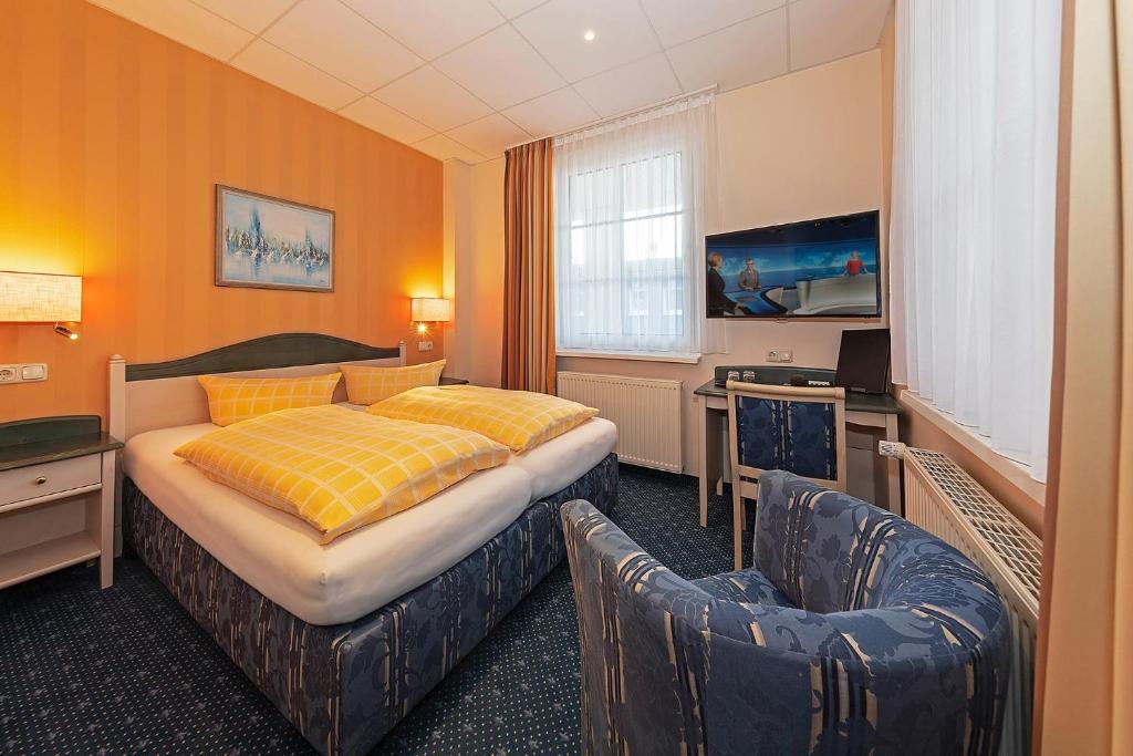 Postel nebo postele na pokoji v ubytování Dünenhotel am Meer