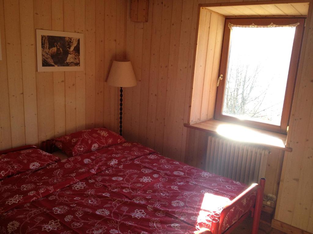 Postel nebo postele na pokoji v ubytování Rifugio Serot