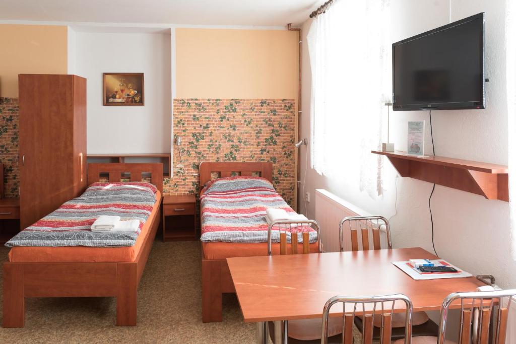 Postel nebo postele na pokoji v ubytování Penzion Lihovar ***