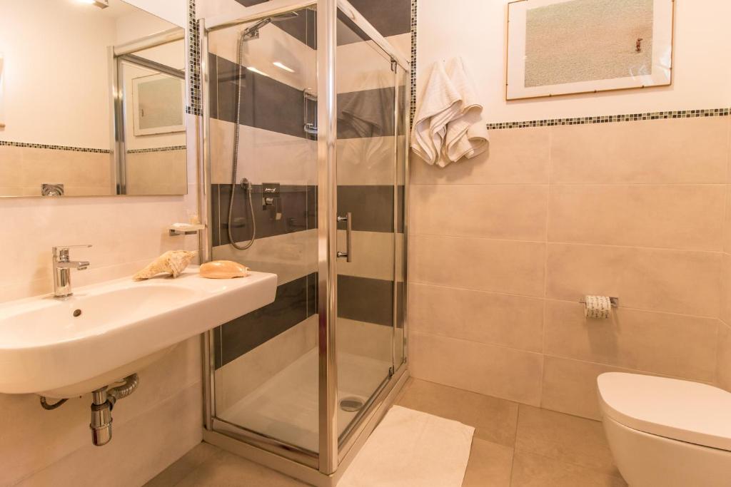 Kúpeľňa v ubytovaní Hotel Il Faro Della Guitgia Tommasino