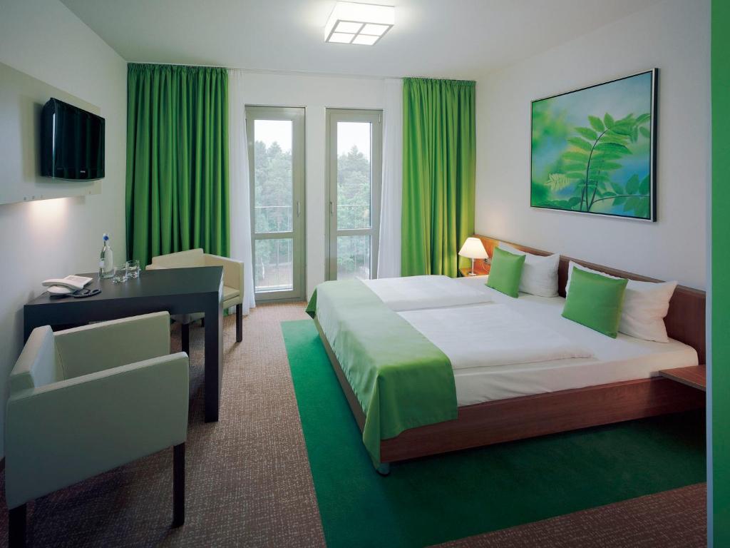 
Ein Bett oder Betten in einem Zimmer der Unterkunft Akademiehotel Dresden
