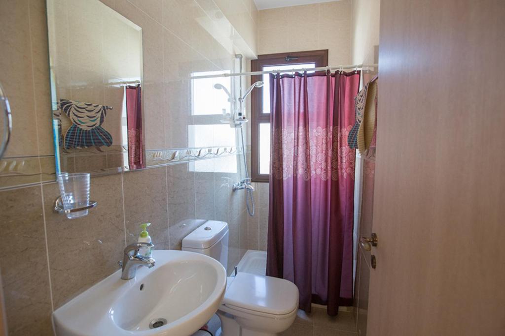 a bathroom with a sink and a toilet and a shower at Picture This, Enjoying Your Holiday in a Luxury 5 Star Villa in Sotira, For Less Than a Hotel, Sotira Villa 1203 in Ayia Napa