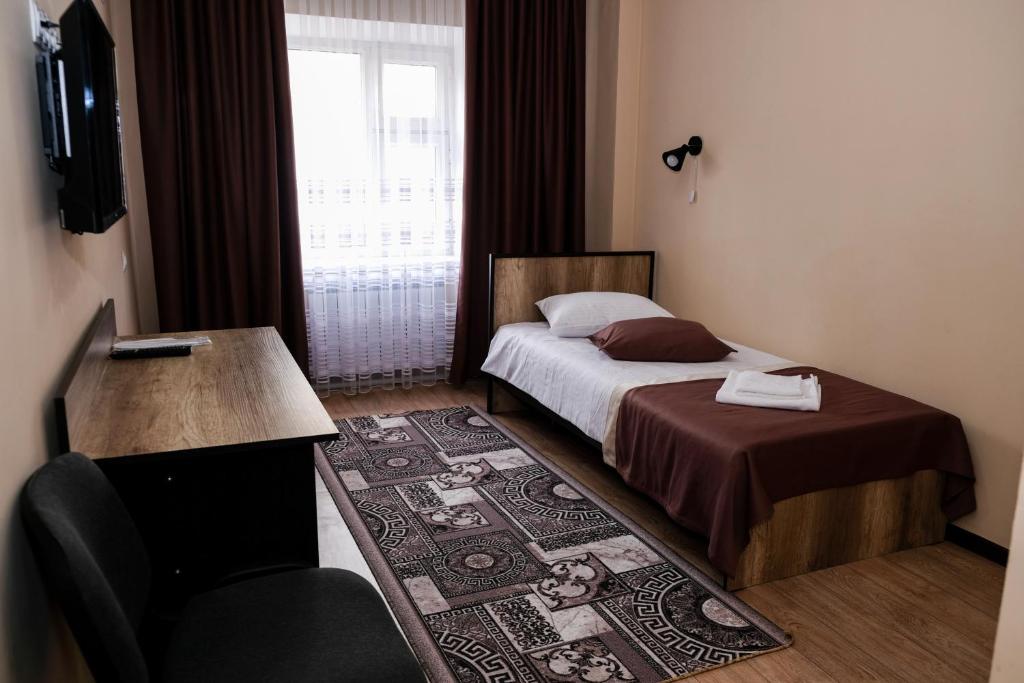 Postel nebo postele na pokoji v ubytování ORIENT