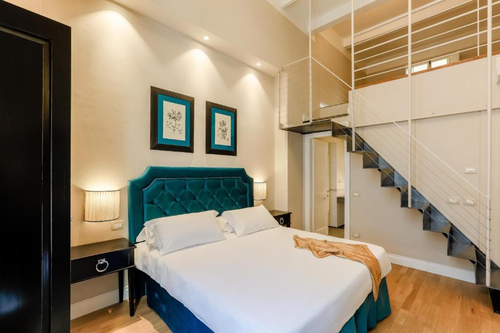 Postel nebo postele na pokoji v ubytování Relais Tosinghi