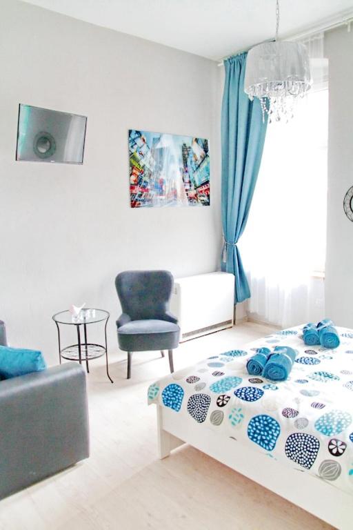 TV a/nebo společenská místnost v ubytování Grey Rooms
