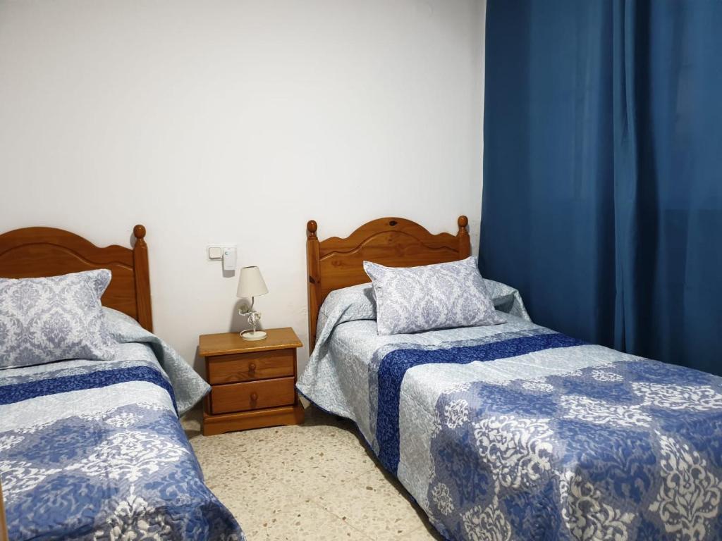 Postel nebo postele na pokoji v ubytování Hostal Gutierrez