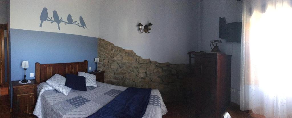 Posteľ alebo postele v izbe v ubytovaní Hotel Rural Posada El Trenti de Corona