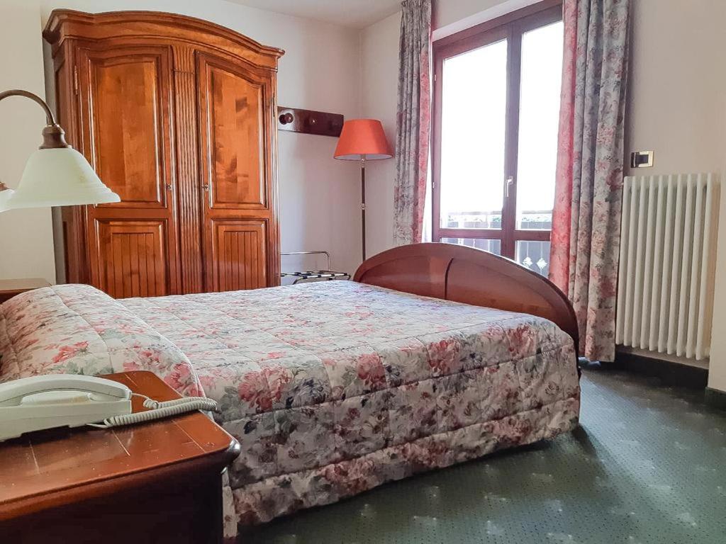 Postel nebo postele na pokoji v ubytování Hotel Panoramique