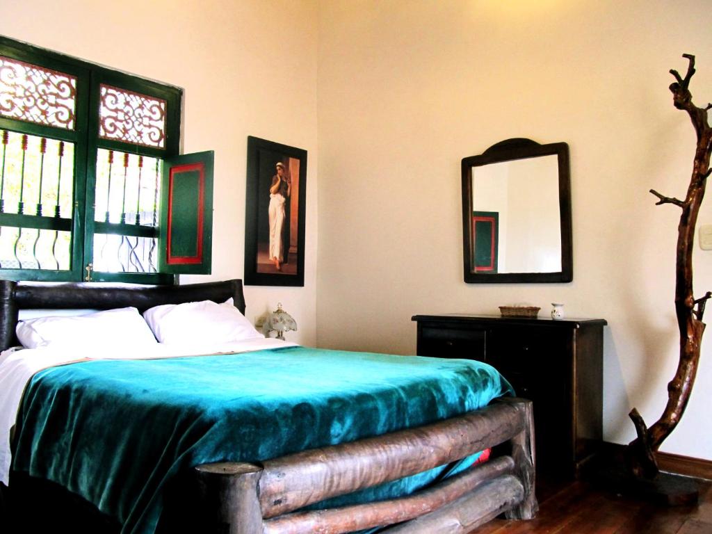 Postel nebo postele na pokoji v ubytování Finca Campestre La Adelita B&B