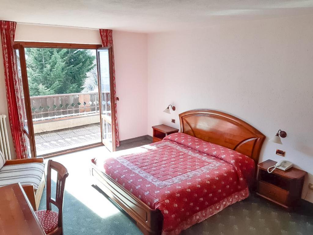 Postel nebo postele na pokoji v ubytování Hotel Panoramique