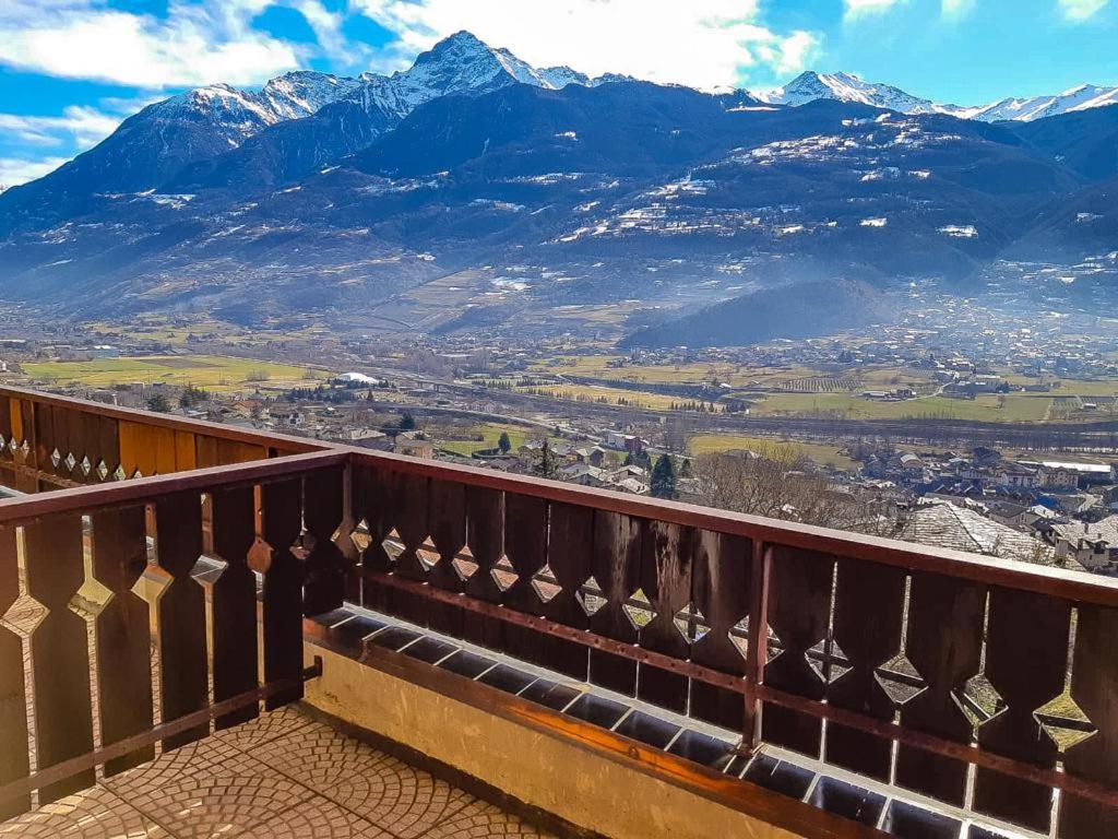 a balcony with a view of a mountain at Hotel Panoramique in Aosta