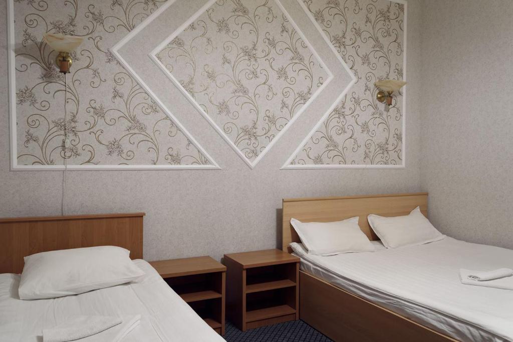 Katil atau katil-katil dalam bilik di Residenz Hotel