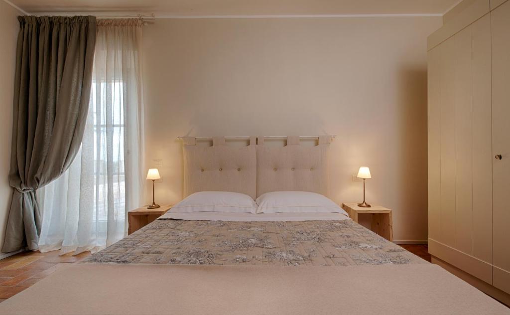 Postel nebo postele na pokoji v ubytování Agriturismo Poderedodici