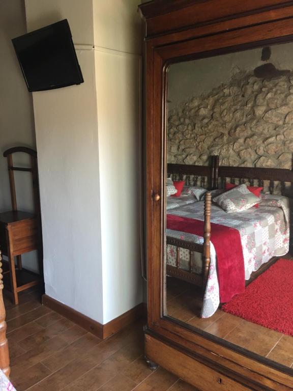 Posteľ alebo postele v izbe v ubytovaní Hotel Rural Posada El Trenti de Corona
