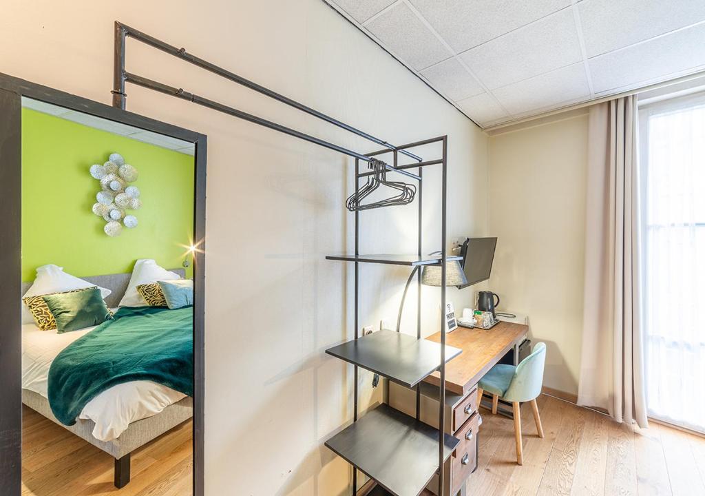Postel nebo postele na pokoji v ubytování Hotel La Legende