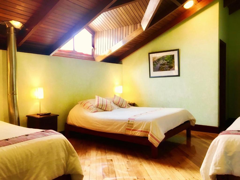 Postel nebo postele na pokoji v ubytování Boutique Hotel Casa Foch