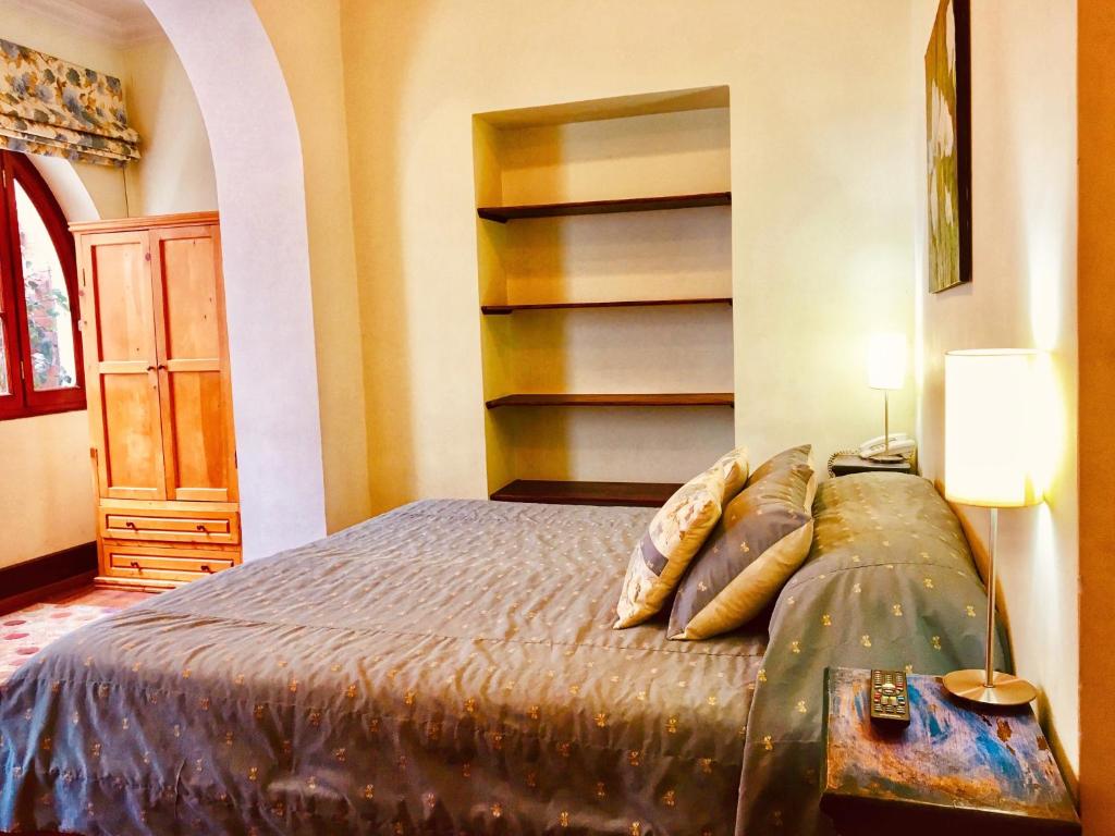 Postel nebo postele na pokoji v ubytování Boutique Hotel Casa Foch