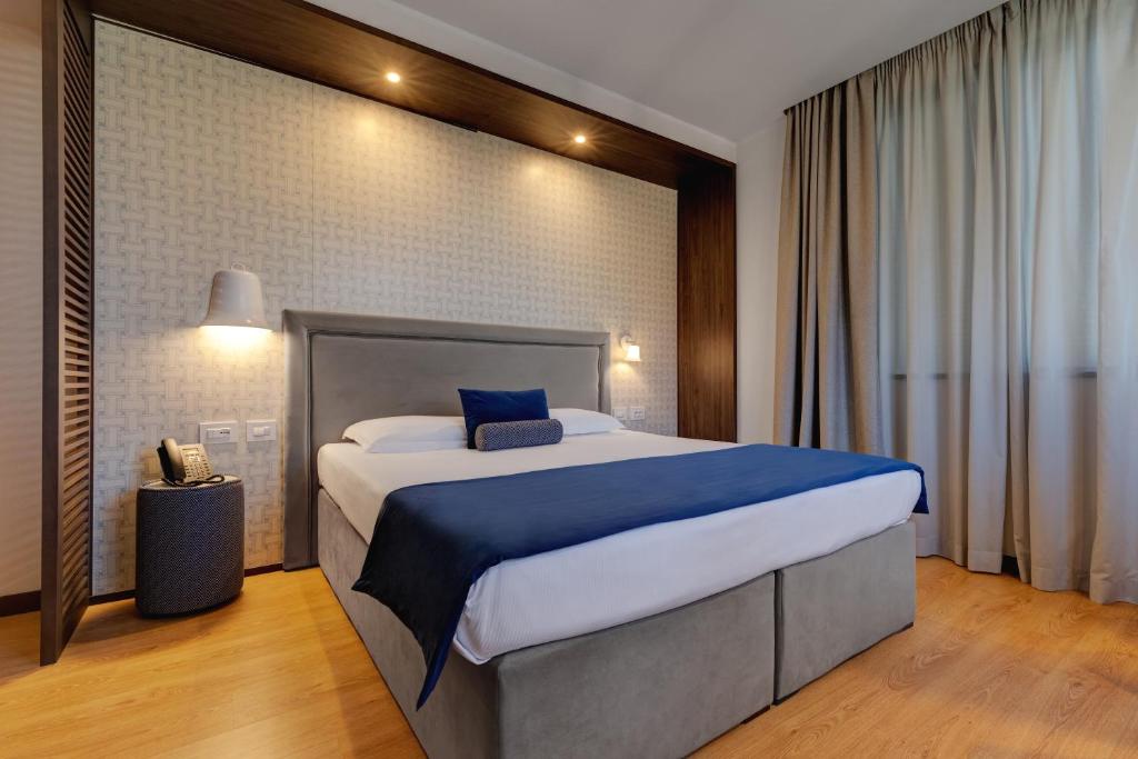 Postel nebo postele na pokoji v ubytování Fly Decó Hotel