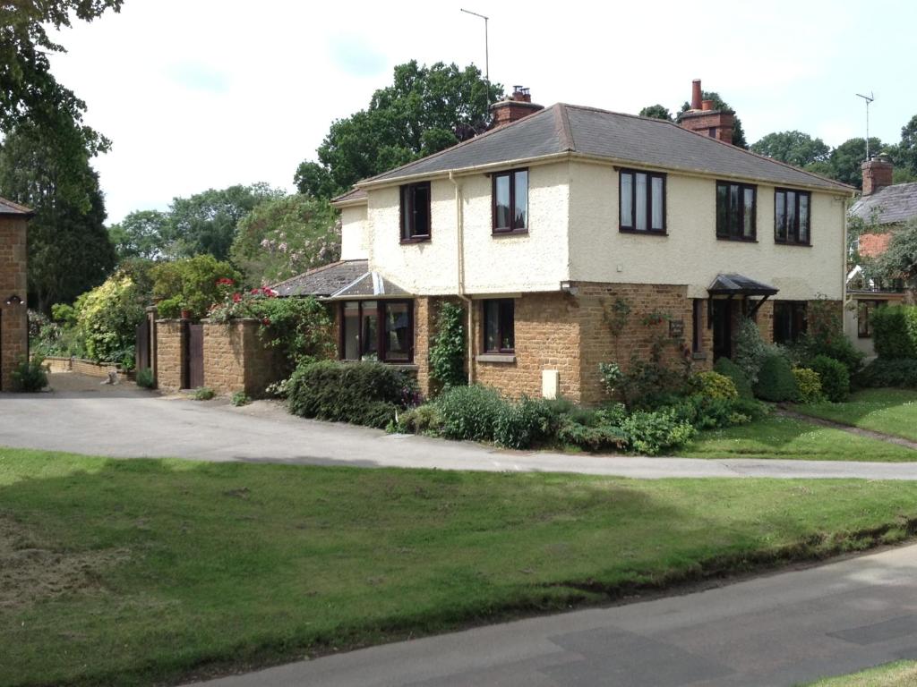 a house on the side of a road at Threeways House in Daventry