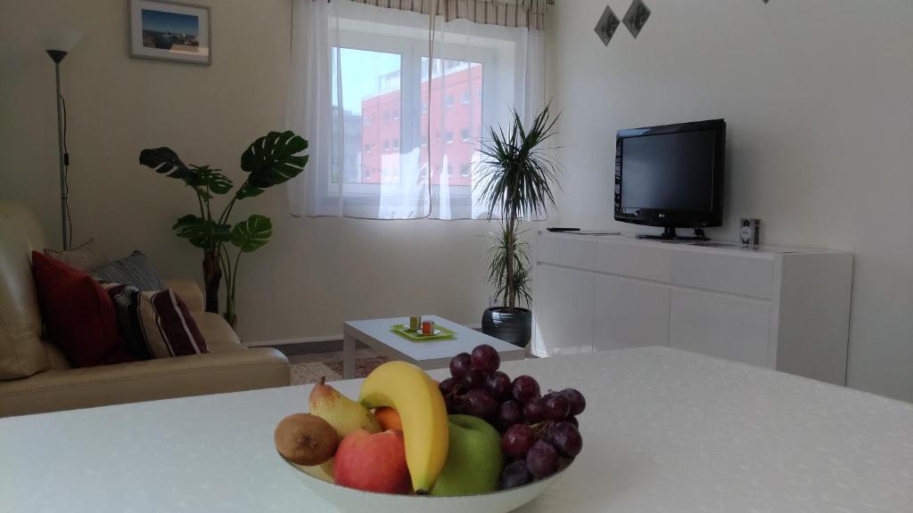 a bowl of fruit on a table in a living room at StaynFeel 01 in Fátima