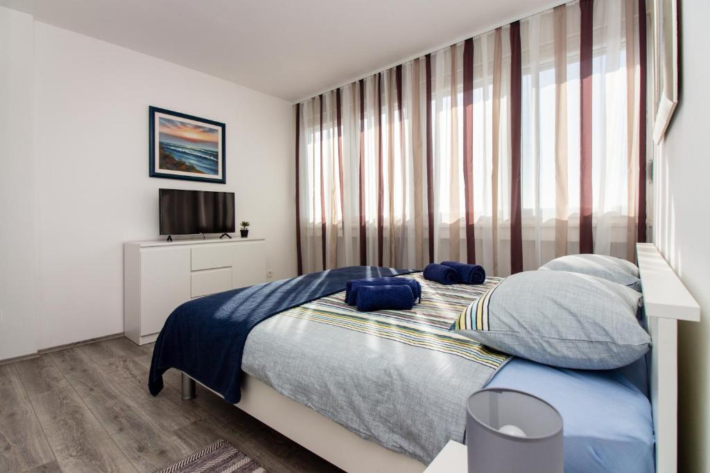 Posteľ alebo postele v izbe v ubytovaní Deluxe Apartment Miro