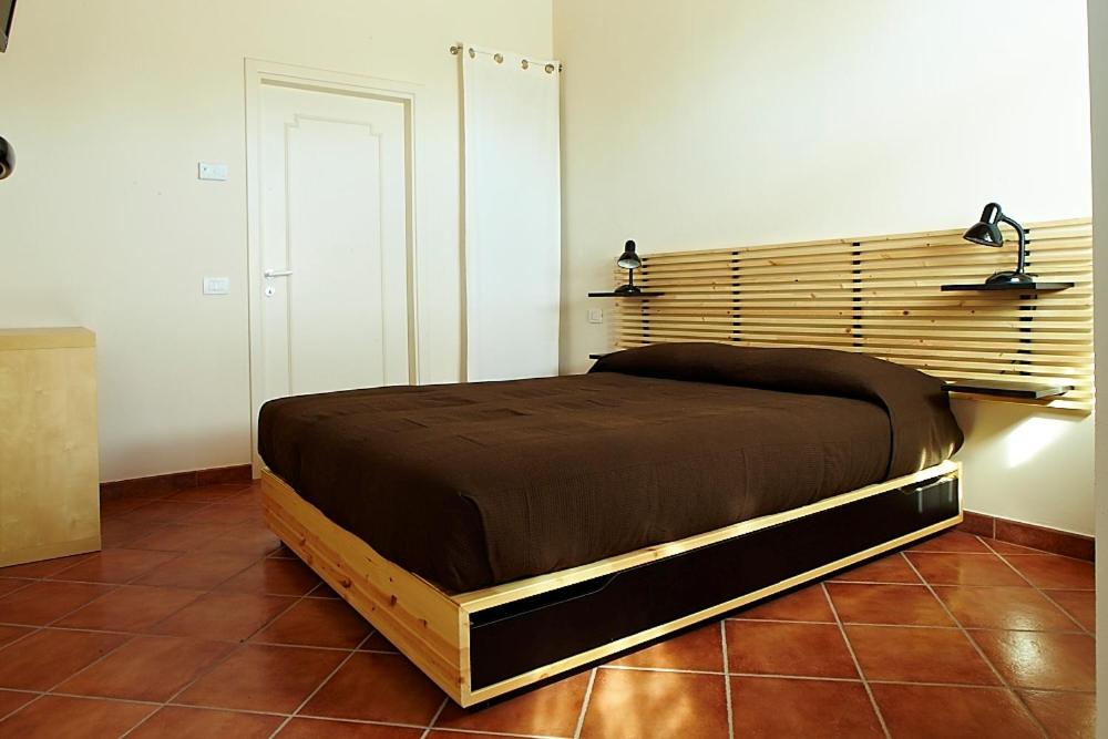 Postel nebo postele na pokoji v ubytování Agriturismo Vignarello