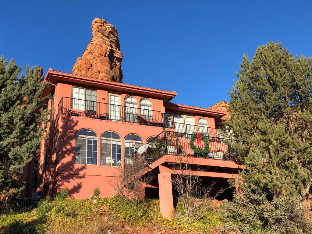 a house with a rock chimney on top of it at The Penrose Bed & Breakfast in Sedona