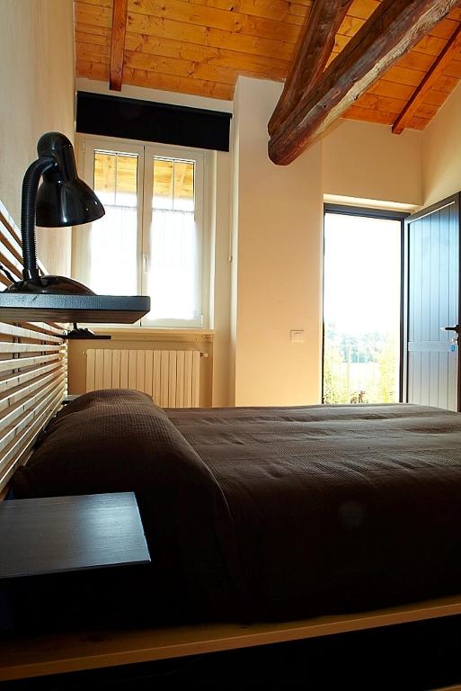 Postel nebo postele na pokoji v ubytování Agriturismo Vignarello