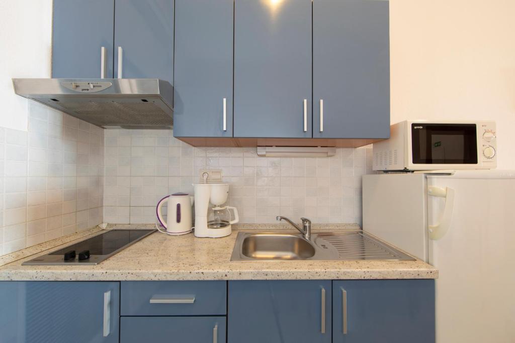 Kuchyň nebo kuchyňský kout v ubytování Apartment Valentina