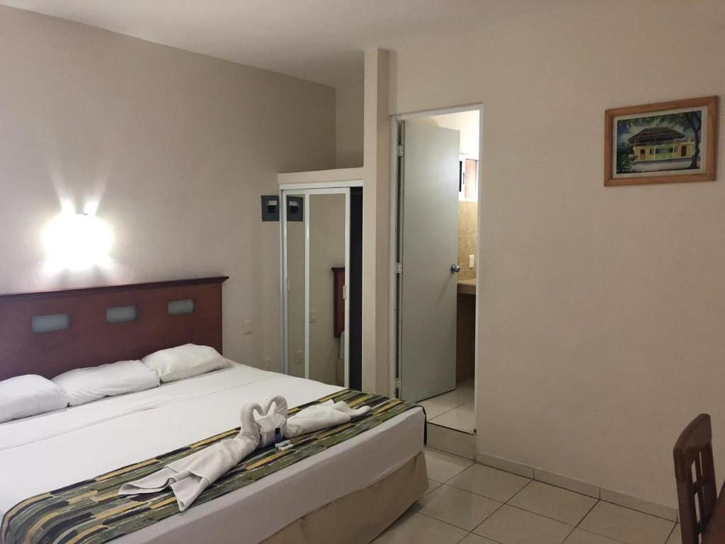 Postel nebo postele na pokoji v ubytování Hotel Xcalak