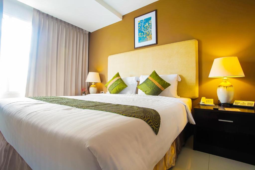 Krevet ili kreveti u jedinici u okviru objekta The Patra Hotel - Rama 9