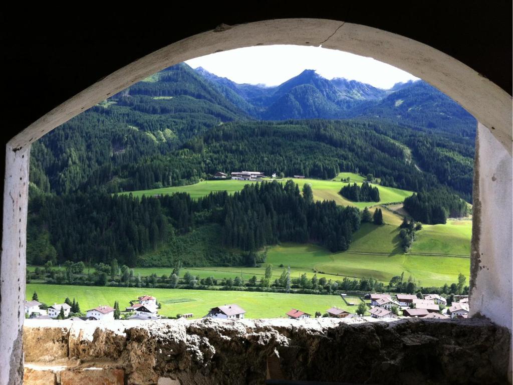 a window with a view of a mountain at Hattlerhof in Heinfels