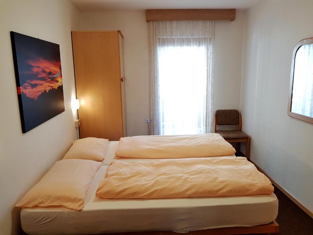 Postel nebo postele na pokoji v ubytování Residence La Zondra