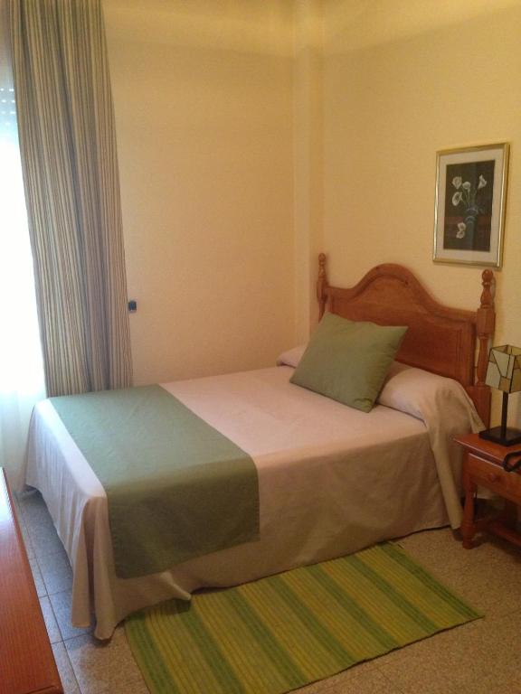 Łóżko lub łóżka w pokoju w obiekcie Hotel Venta del Pobre