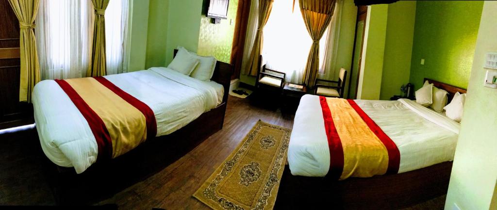Postel nebo postele na pokoji v ubytování Kathmandu Garden Home