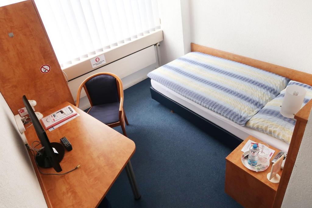 Postel nebo postele na pokoji v ubytování Budget Motel Self Check-In