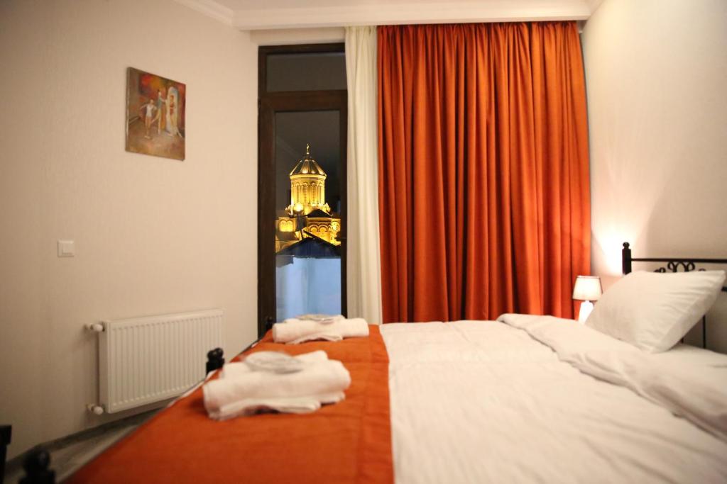 Postel nebo postele na pokoji v ubytování X Palace