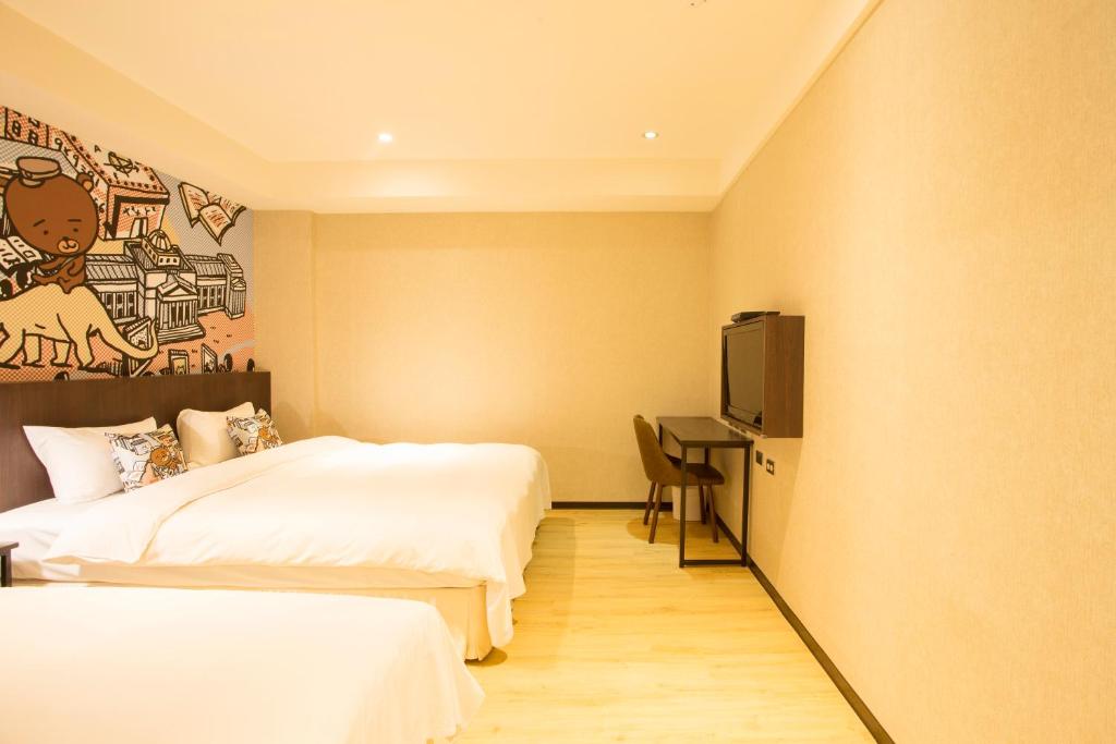 Postel nebo postele na pokoji v ubytování Just Live Inn-Taipei Station