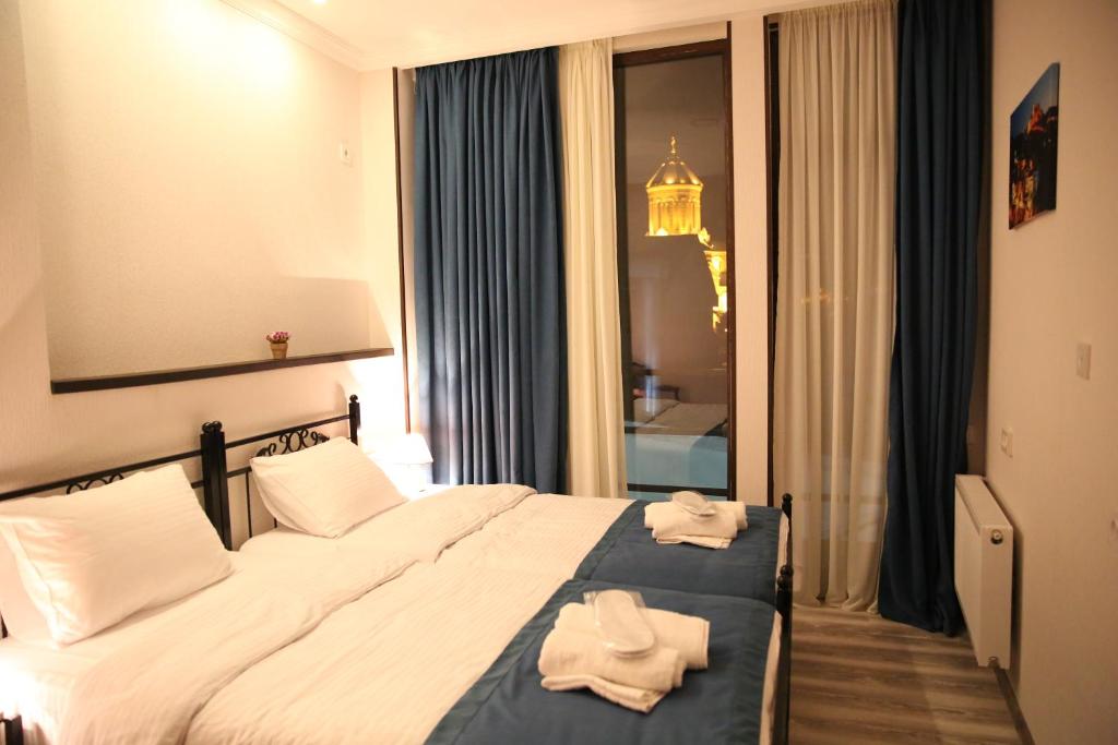 Postel nebo postele na pokoji v ubytování X Palace